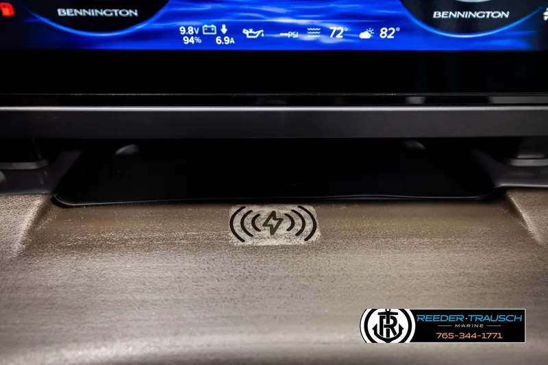 Slide: The Image of Dashboard of 2026 Bennington MFBSE with digital display and wireless charging pad. - 34