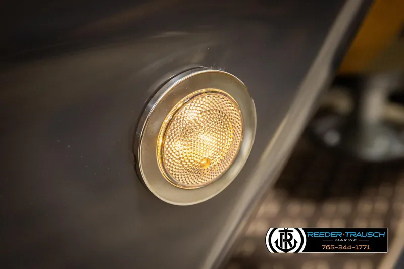 Slide: The Image of Close-up of a 2026 Bennington MFBSE boat light with Reeder-Trausch Marine logo. - 44