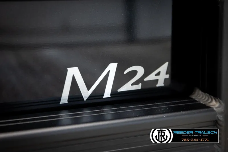 Slide: The Image of 2026 Bennington MFBSE boat with M24 marking, Reeder-Trausch Marine logo visible. - 48