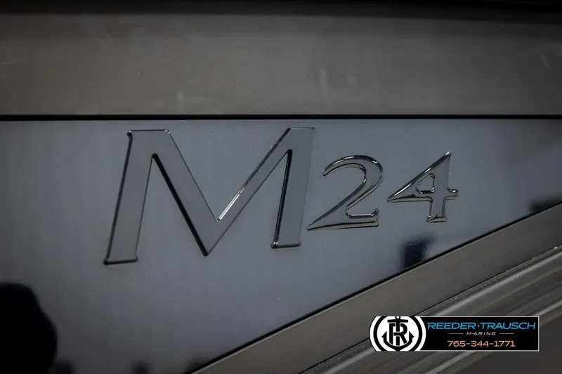 Slide: The Image of 2026 Bennington MFBSE boat with M24 emblem, Reeder-Trausch Marine branding. - 51