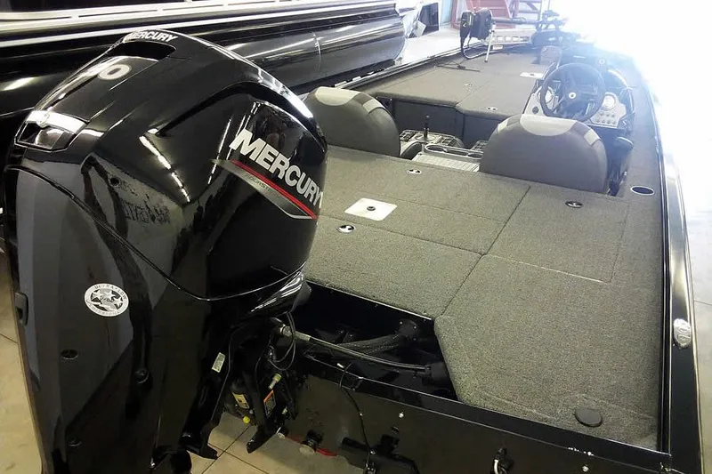 Slide: The Image of 2024 Lund 1775 Renegade boat with Mercury engine, interior view. - 1