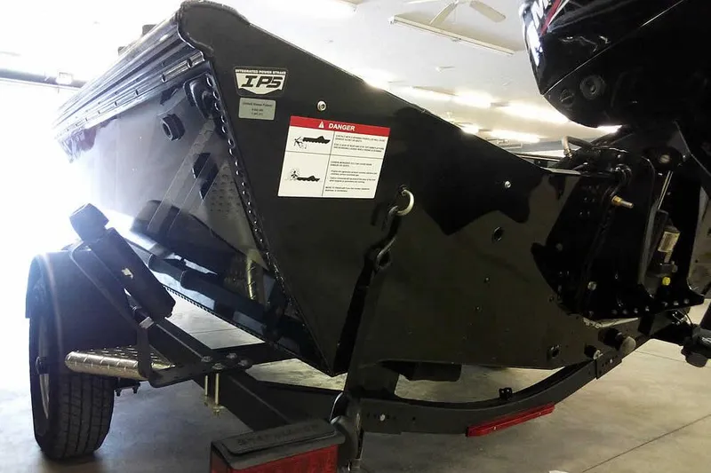 Slide: The Image of 2024 Lund 1775 Renegade boat on trailer, rear view in indoor setting. - 11