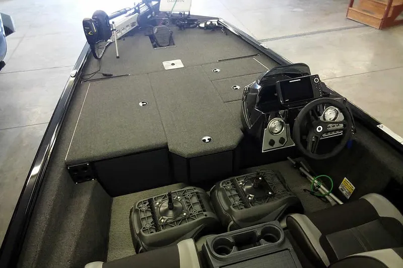 Slide: The Image of 2024 Lund 1775 Renegade boat interior with steering console and seating. - 13