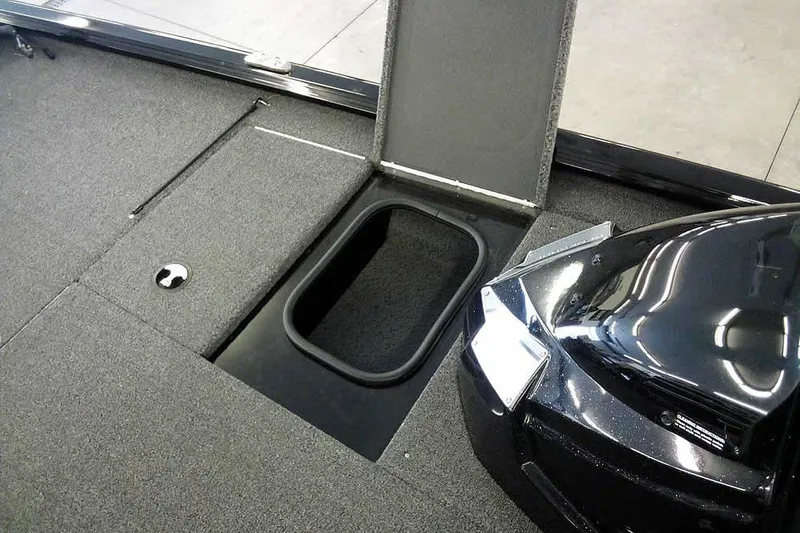 Slide: The Image of 2024 Lund 1775 Renegade boat interior with open storage compartment. - 15