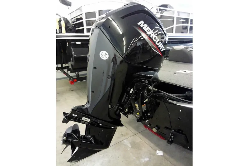 Slide: The Image of 2024 Lund 1775 Renegade boat with Mercury outboard motor in a showroom. - 2