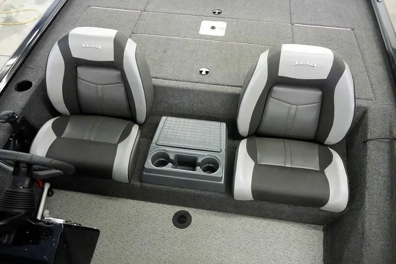 Slide: The Image of 2024 Lund 1775 Renegade boat interior with dual seats and center console. - 21