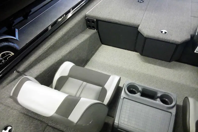 Slide: The Image of 2024 Lund 1775 Renegade boat interior with seating and cup holders. - 24