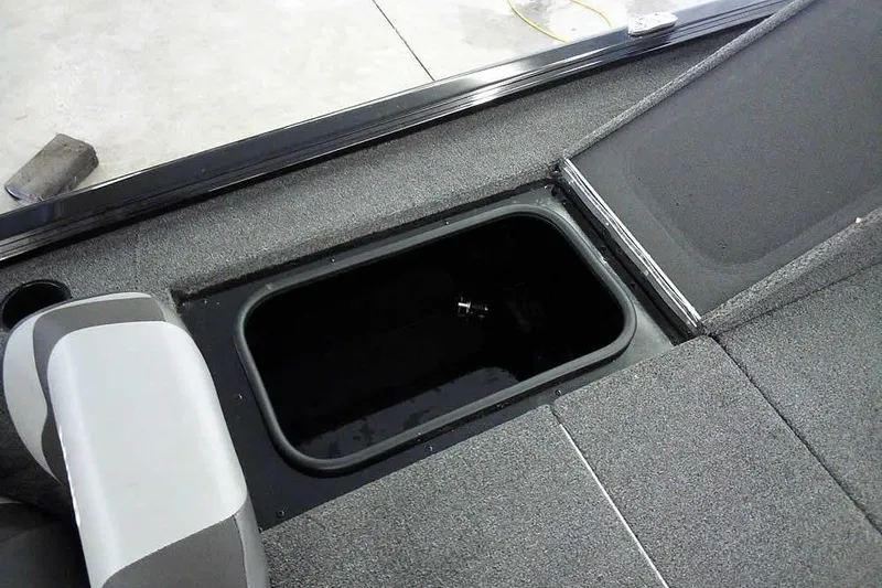 Slide: The Image of 2024 Lund 1775 Renegade boat interior with open storage compartment. - 29