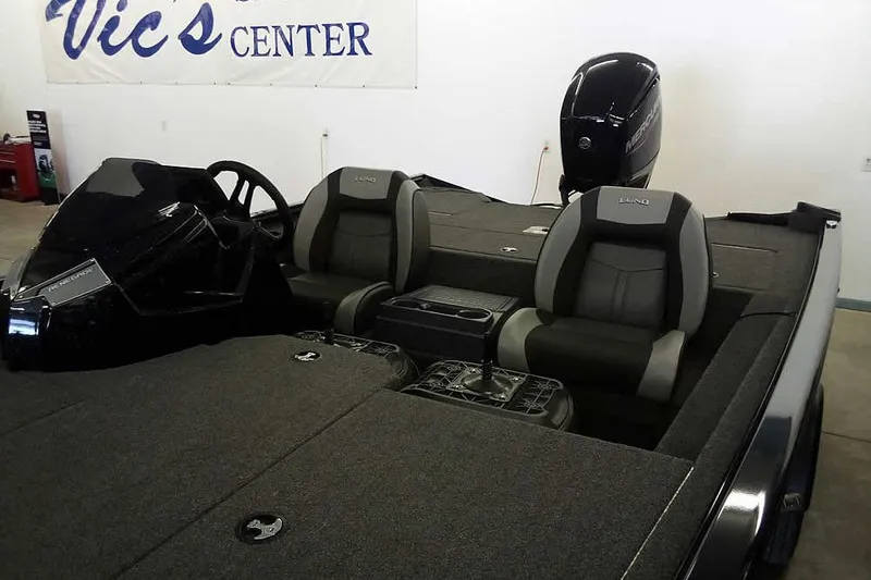 Slide: The Image of 2024 Lund 1775 Renegade boat interior with dual seats and Mercury outboard motor. - 9