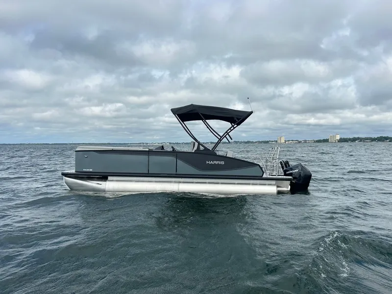 Slide: The Image of Harris Sunliner 230 pontoon boat 2026 on open water. - 0