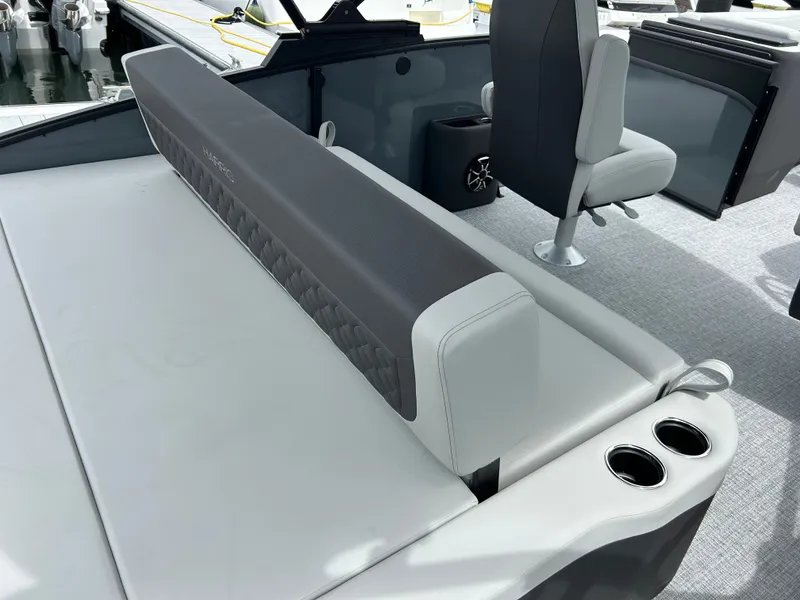 Slide: The Image of Interior of Harris Sunliner 230 boat, 2026 model, featuring gray seating. - 11