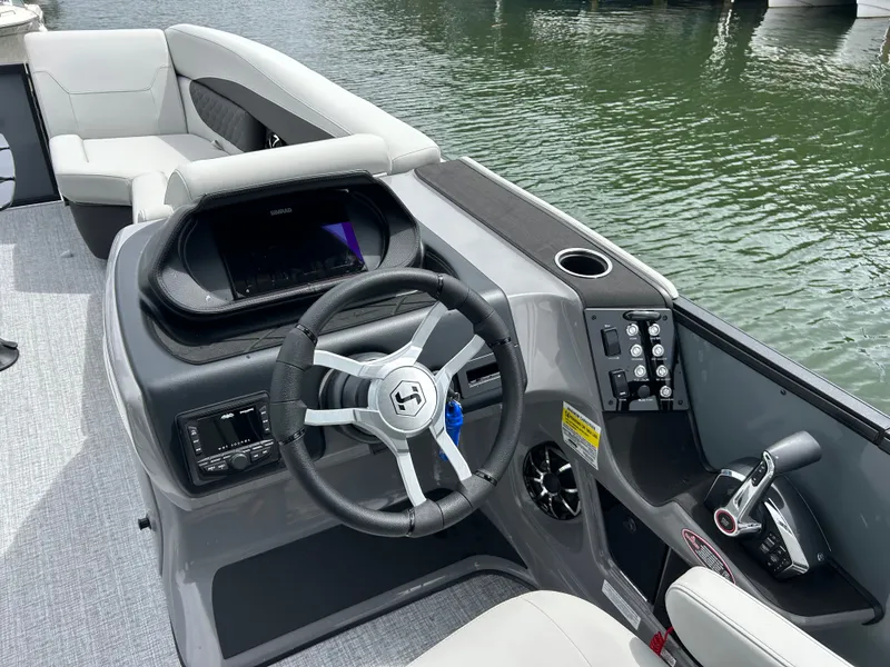 Slide: The Image of Interior view of Harris Sunliner 230 boat, model year 2026. - 16