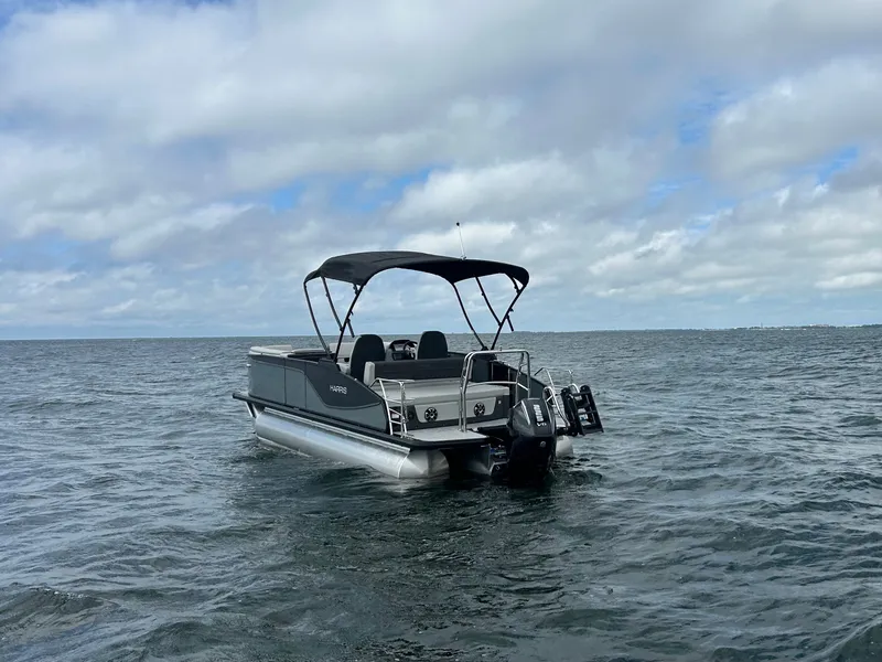 Slide: The Image of Harris Sunliner 230 pontoon boat 2026 on open water. - 2