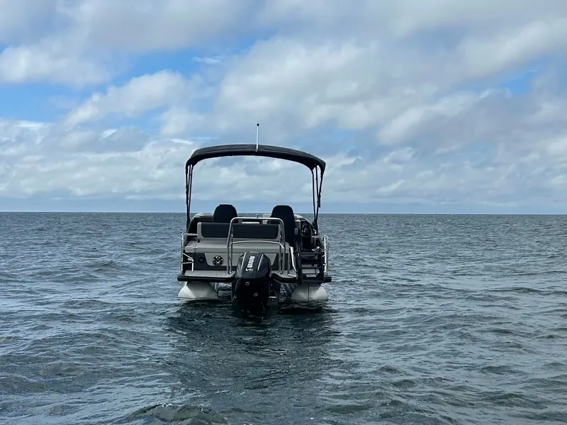 Slide: The Image of Harris Sunliner 230 pontoon boat on open sea, 2026 model. - 3