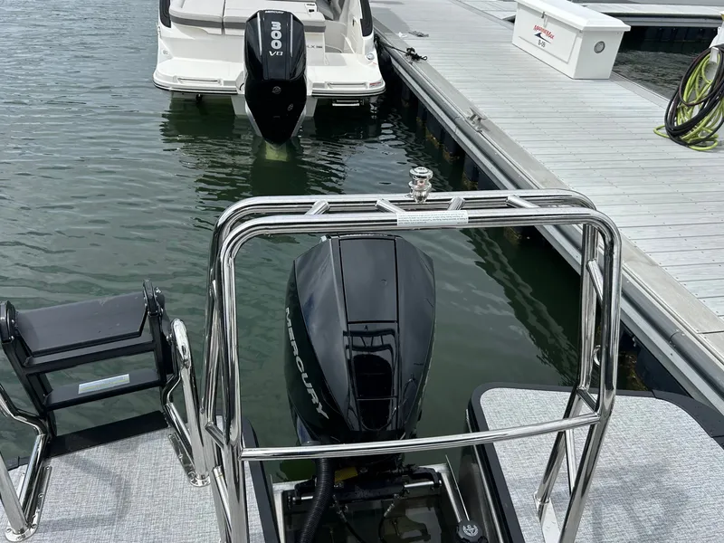 Slide: The Image of Harris Sunliner 230 boat with Mercury engine at dock, year 2026. - 8