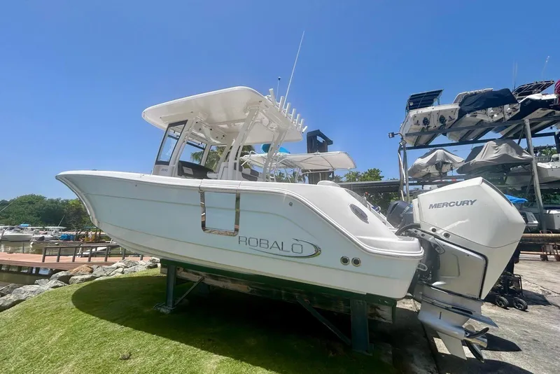The Image of 2021 Robalo R302 Center Console boat with Mercury engine on display. - 1