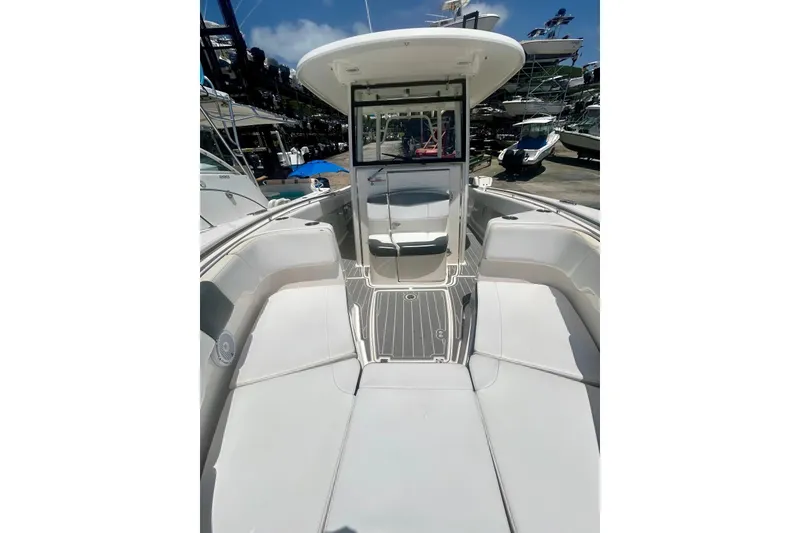 Slide: The Image of 2021 Robalo R302 Center Console boat interior with seating and console view. - 10