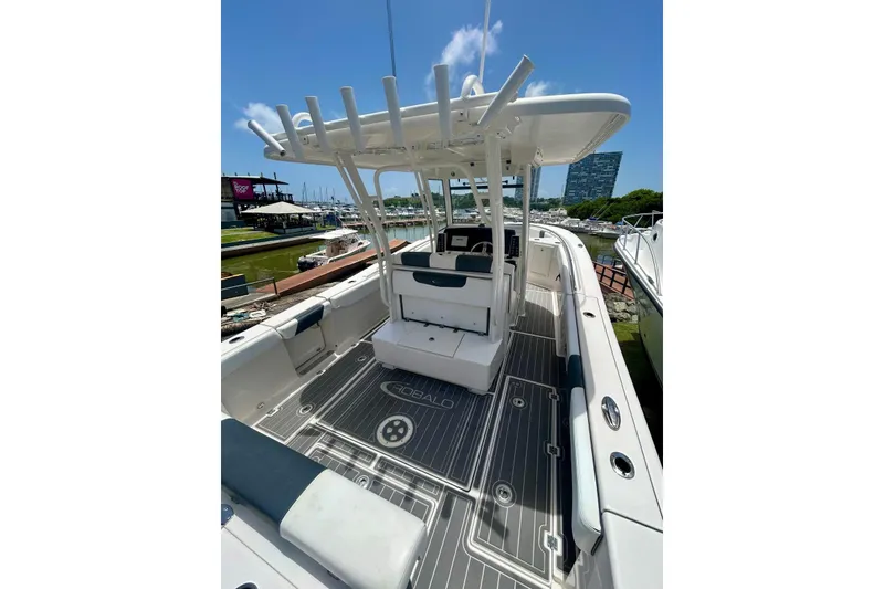 Slide: The Image of 2021 Robalo R302 Center Console boat with spacious deck and modern design. - 15