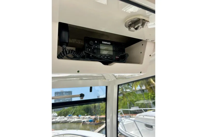 Slide: The Image of 2021 Robalo R302 Center Console with Simrad marine radio installed. - 16