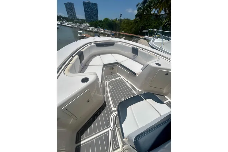 Slide: The Image of 2021 Robalo R302 Center Console boat interior with seating and modern design. - 3
