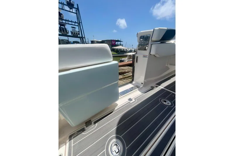 Slide: The Image of 2021 Robalo R302 Center Console boat interior with sleek deck and seating. - 5
