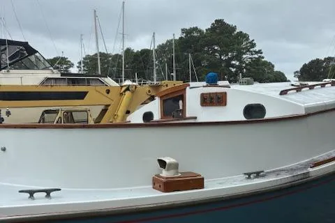 Slide: The Image of 1981 Mark O Atlantic City 24 sailboat docked at marina with overcast sky. - 5