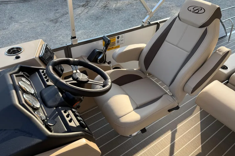 Slide: The Image of Captain's chair and helm of 2026 Bentley Pontoons Legacy 243 Swingback EXT. - 14