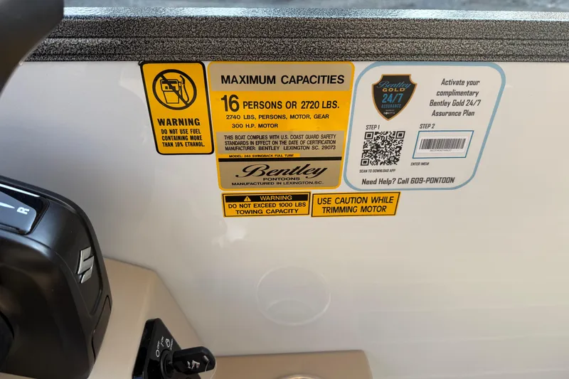 Slide: The Image of 2026 Bentley Pontoons Legacy 243 Swingback EXT capacity and safety labels, featuring warnings and assurance plan. - 15