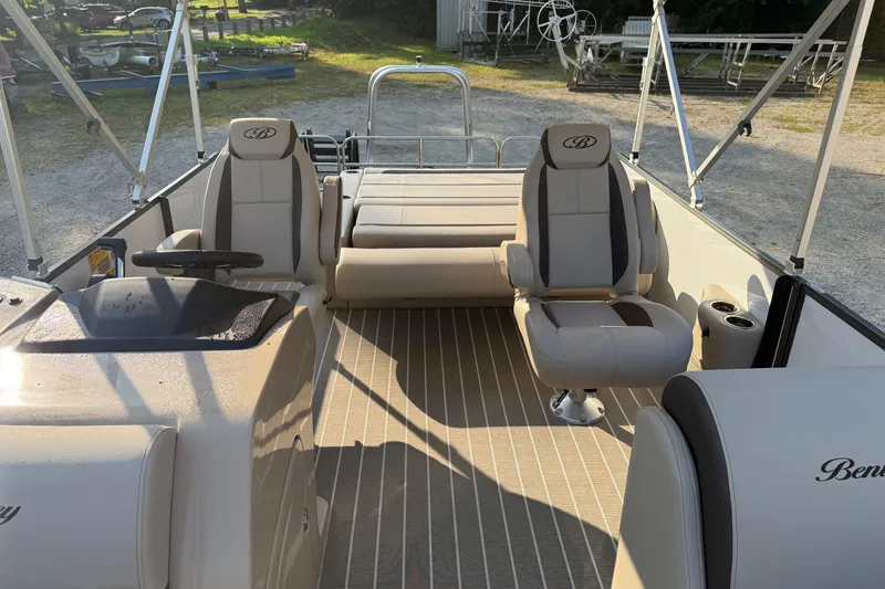 Slide: The Image of 2026 Bentley Pontoons Legacy 243 Swingback EXT interior with luxurious seating and helm. - 19