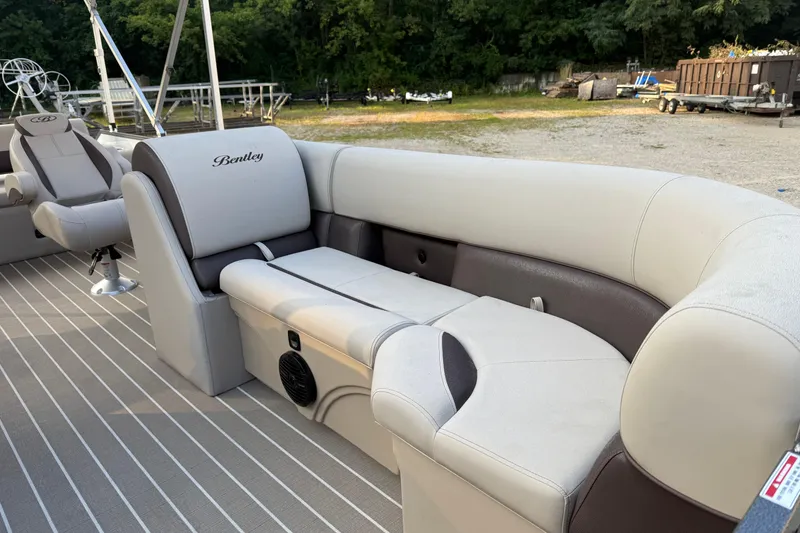 Slide: The Image of 2026 Bentley Pontoons Legacy 243 Swingback EXT with luxurious seating and sleek design. - 5