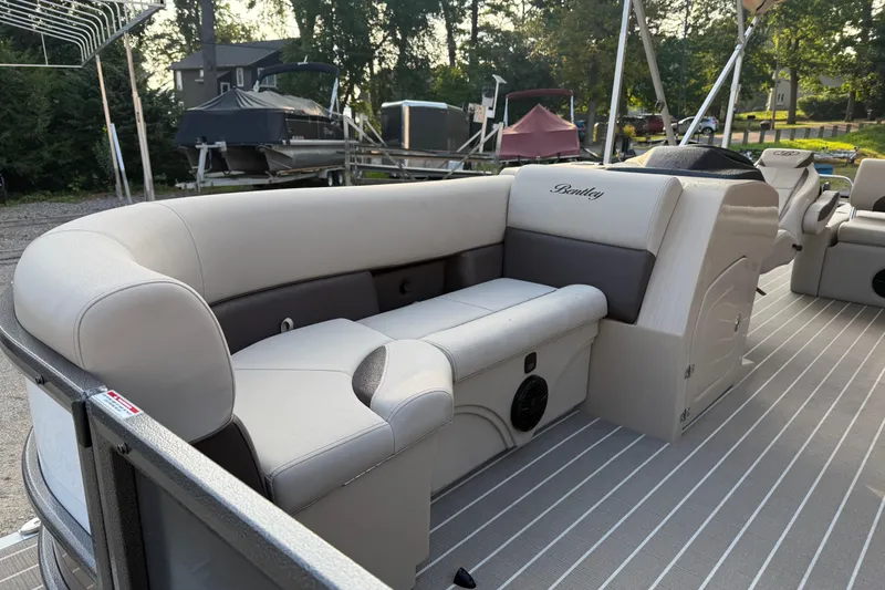 Slide: The Image of 2026 Bentley Pontoons Legacy 243 Swingback EXT with luxurious seating and sleek design. - 6