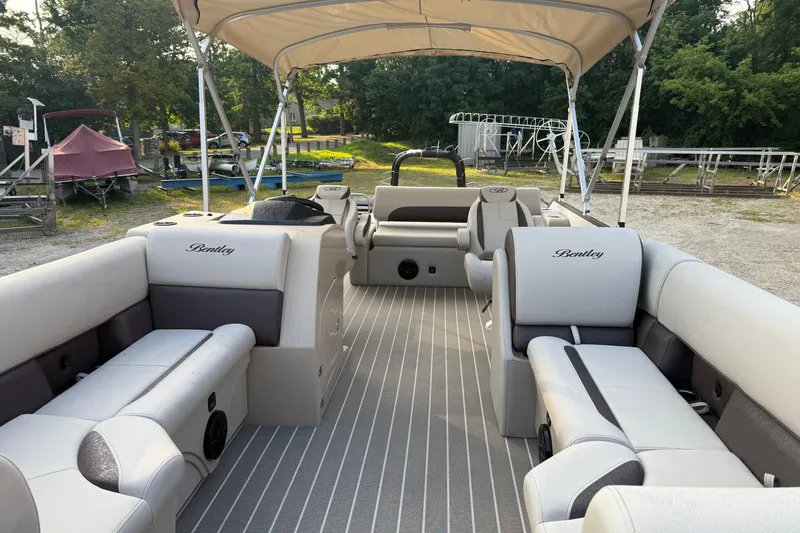 Slide: The Image of 2026 Bentley Pontoons Legacy 243 Swingback EXT with spacious seating and canopy. - 7