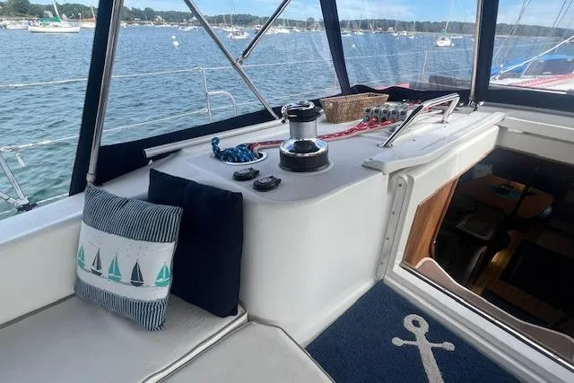 Slide: The Image of Cockpit of 2003 Catalina 470 Sloop with Wing Keel, featuring nautical decor and winch. - 22