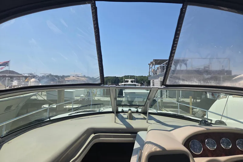 Slide: The Image of View from the helm of a 2007 Sea Ray 320 Sundancer at a marina. - 10