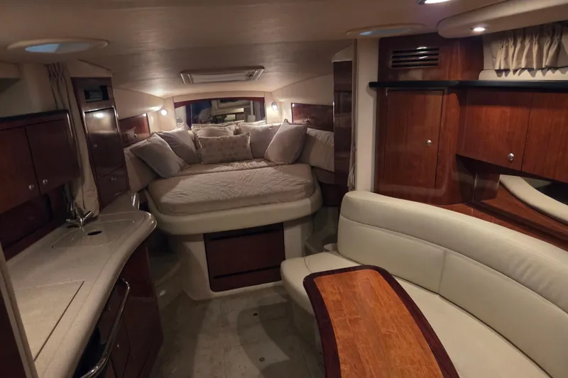 Slide: The Image of Luxurious interior of 2007 Sea Ray 320 Sundancer yacht with cozy seating and elegant wood finishes. - 11