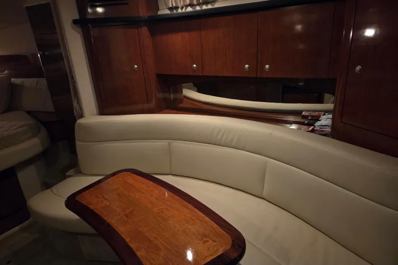 Slide: The Image of Luxurious interior of 2007 Sea Ray 320 Sundancer with elegant wood and leather seating. - 12
