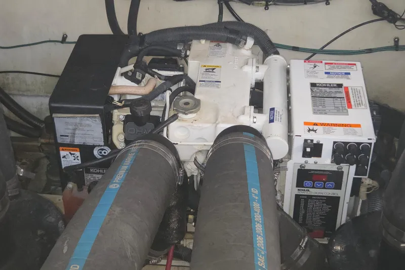 Slide: The Image of Engine compartment of a 2007 Sea Ray 320 Sundancer with Kohler generator. - 23