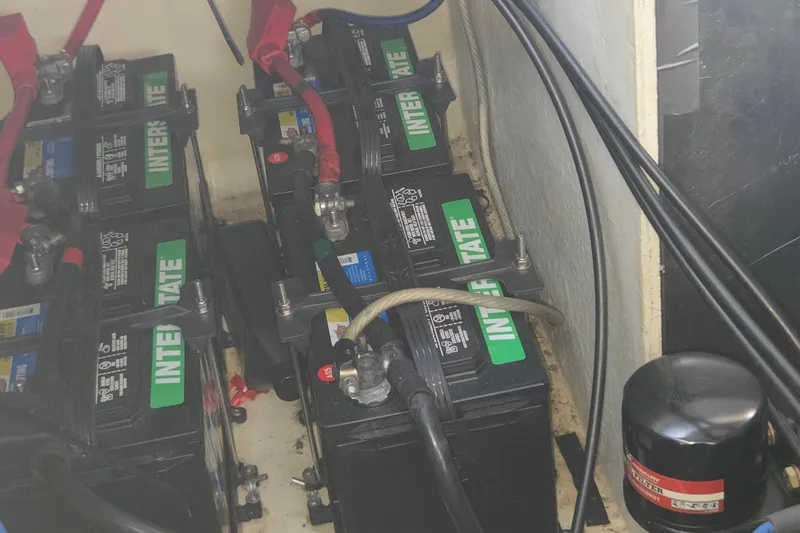 Slide: The Image of Batteries in a 2007 Sea Ray 320 Sundancer boat engine compartment. - 24