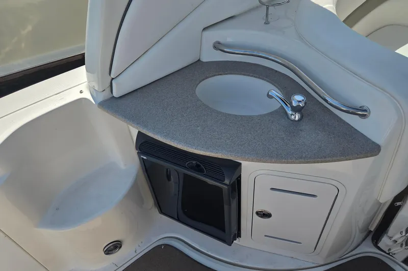 Slide: The Image of 2007 Sea Ray 320 Sundancer boat kitchenette with sink and storage. - 6