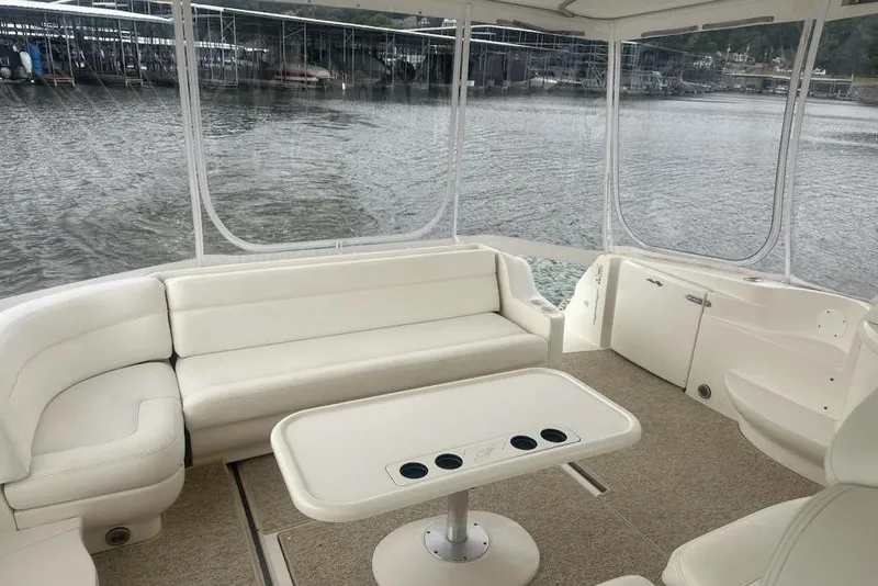 Slide: The Image of Spacious interior of 2003 Sea Ray Sundancer 460 yacht with white seating and table. - 17