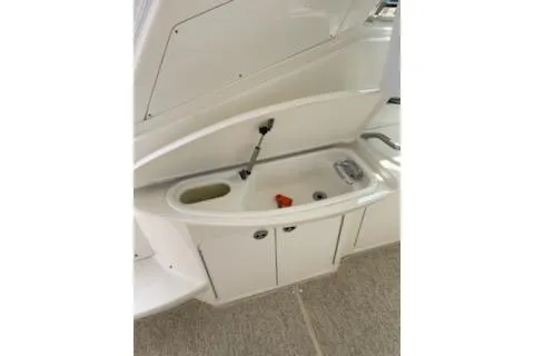 Slide: The Image of 2003 Sea Ray Sundancer 460 yacht sink and storage area. - 18
