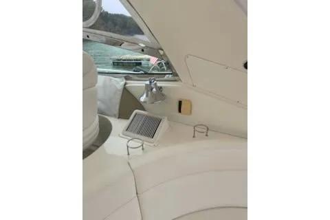 Slide: The Image of 2003 Sea Ray Sundancer 460 interior with seating and window view. - 20