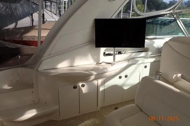 Slide: The Image of Interior of 2003 Sea Ray Sundancer 460 yacht with TV and seating area. - 22