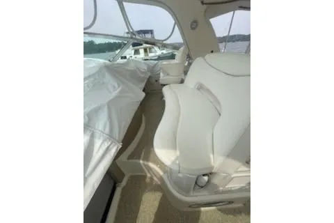 Slide: The Image of 2003 Sea Ray Sundancer 460 interior with white seating and covered area. - 26