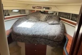 Slide: The Image of Luxurious cabin interior of 2003 Sea Ray Sundancer 460 yacht with plush bedding. - 29
