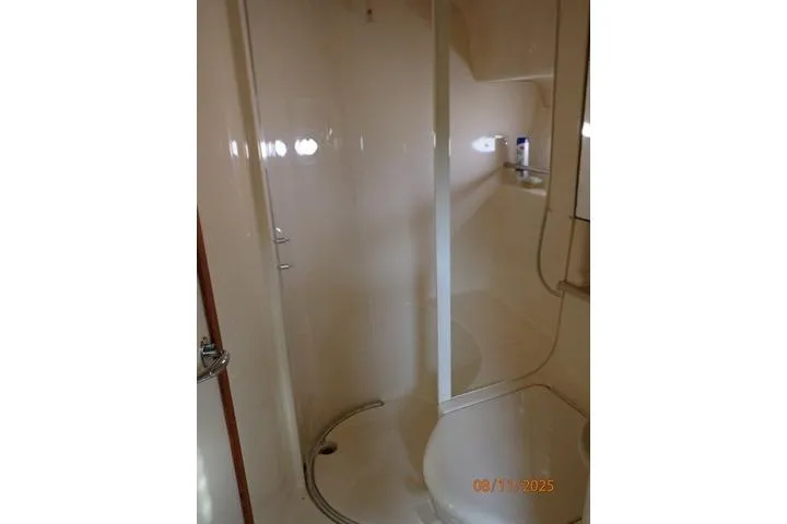 Slide: The Image of Bathroom interior of 2003 Sea Ray Sundancer 460 yacht, featuring a shower and sink. - 34