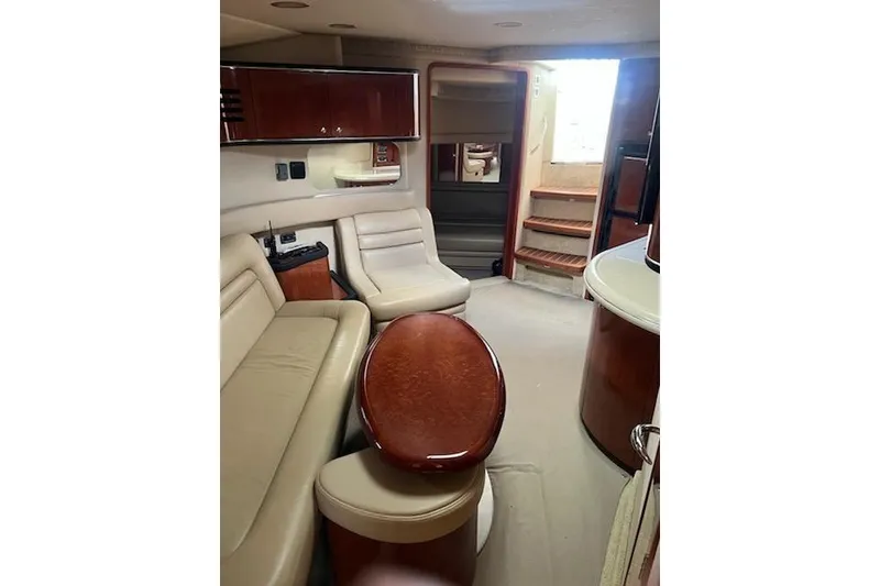 Slide: The Image of Interior of 2003 Sea Ray Sundancer 460 yacht with elegant seating and wooden finishes. - 36