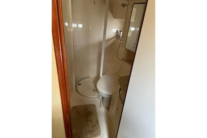 Slide: The Image of Bathroom interior of 2003 Sea Ray Sundancer 460 yacht, featuring shower and toilet. - 37