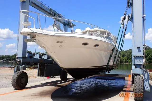 Slide: The Image of 2003 Sea Ray Sundancer 460 yacht being lifted by a boat hoist. - 4