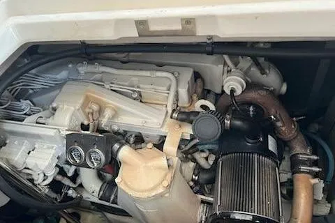 Slide: The Image of Engine compartment of a 2003 Sea Ray Sundancer 460 boat, showcasing mechanical components. - 42